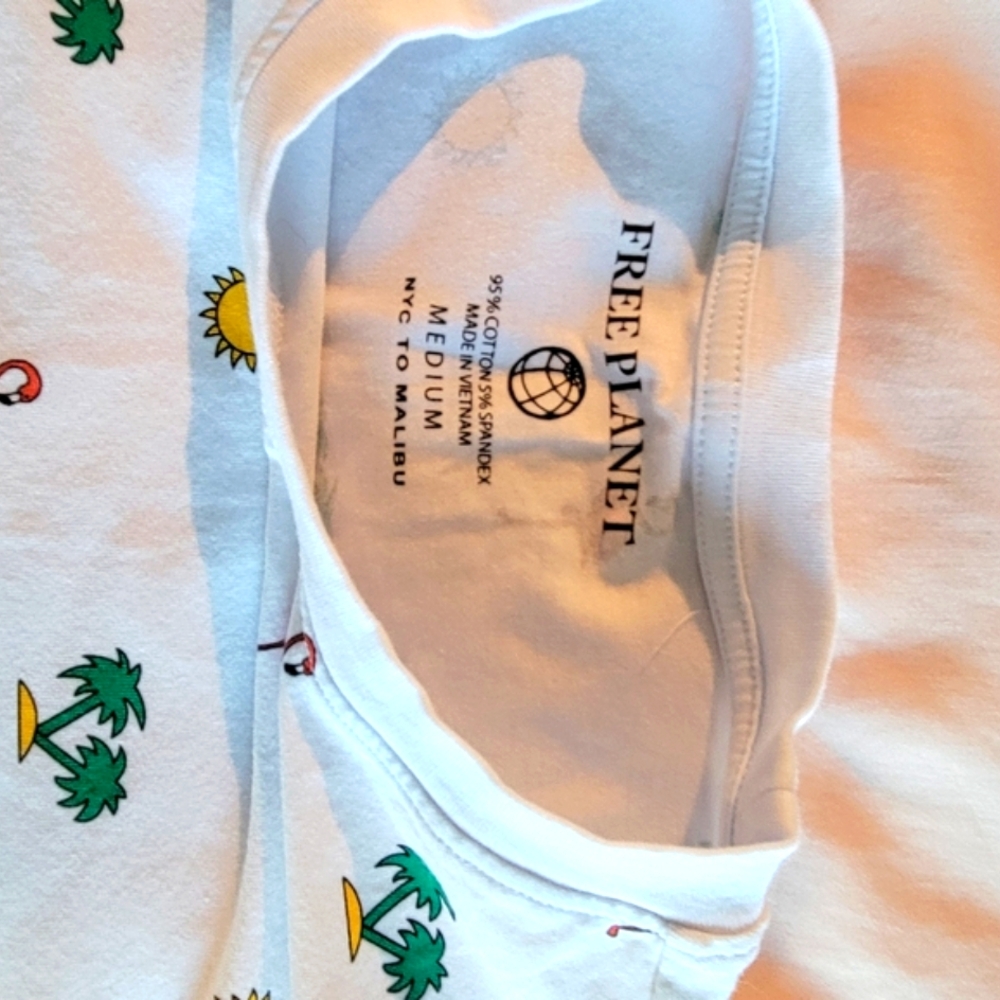 FREE PLANET men's white t-shirt with palms, flamingos, and sun print. Li…